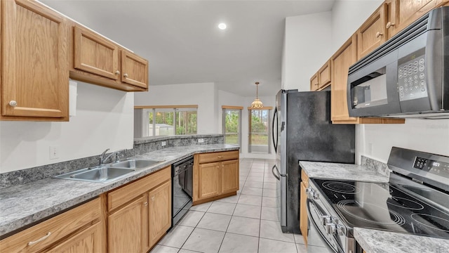 kitchen with black appliances, light tile patterned floors, and sink