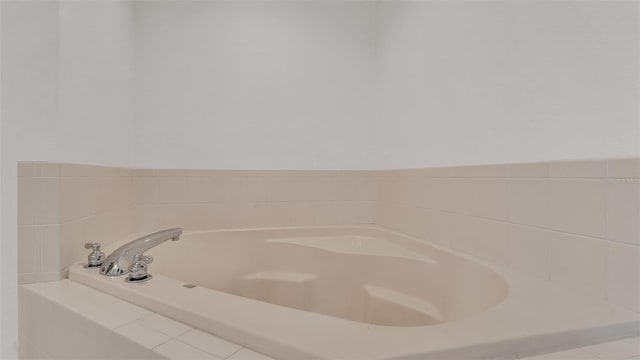 bathroom with tiled bath