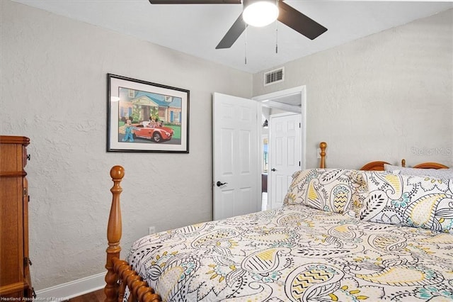 bedroom featuring hardwood / wood-style flooring and ceiling fan