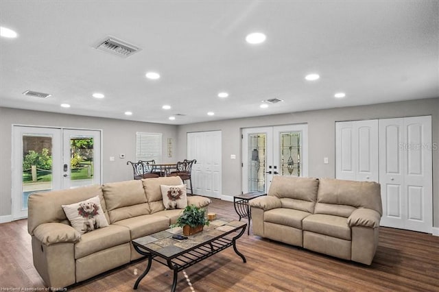 living room with french doors and wood-type flooring