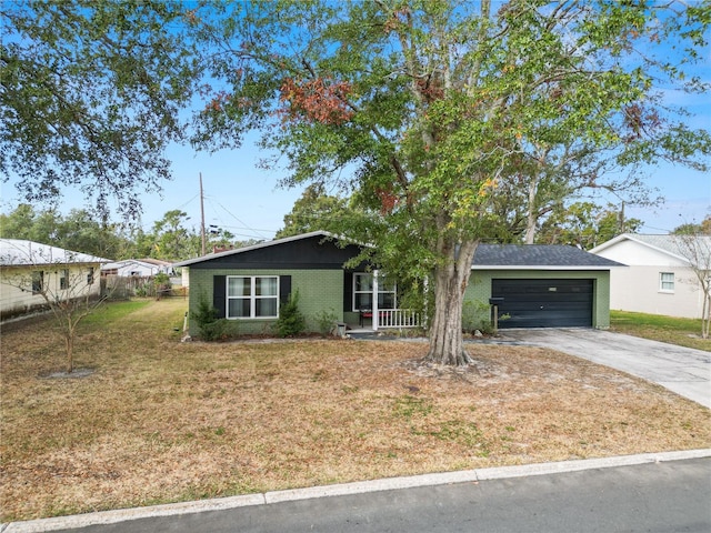 view of front of house with a front lawn and a garage