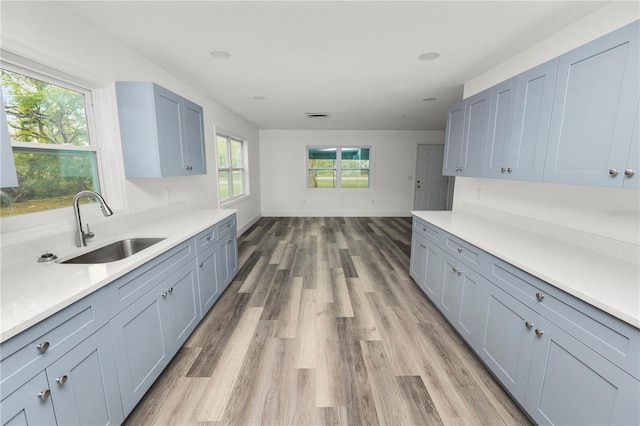 kitchen featuring sink and light hardwood / wood-style flooring