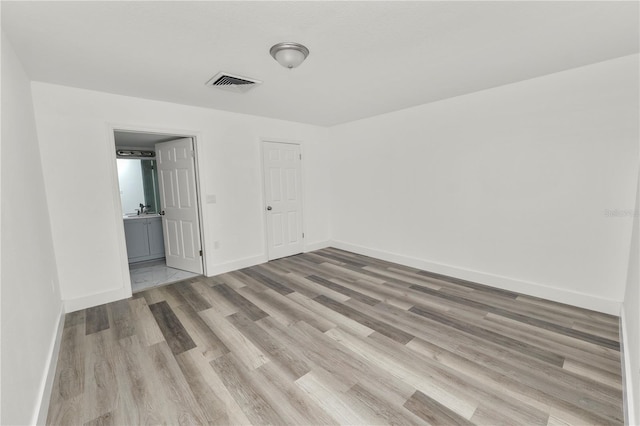 unfurnished room featuring light wood-type flooring