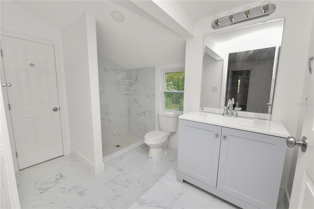 bathroom featuring toilet, vanity, lofted ceiling, and tiled shower