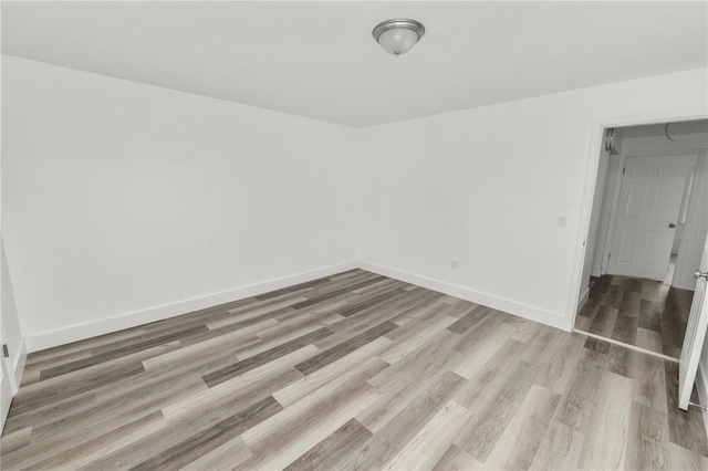 spare room featuring light wood-type flooring