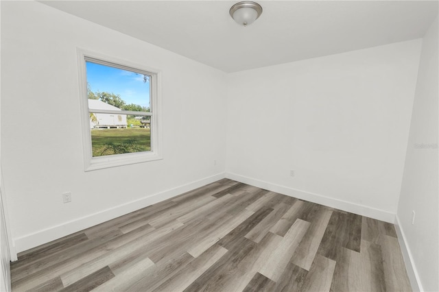 empty room with wood-type flooring