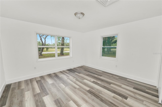 empty room with light hardwood / wood-style floors