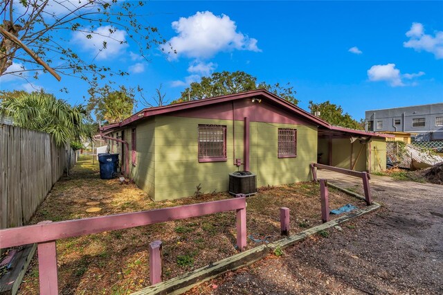 view of side of property featuring central AC