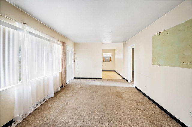 spare room with light colored carpet