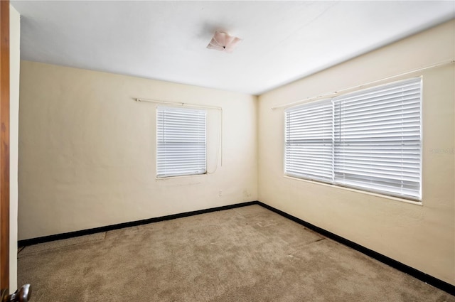 empty room with light colored carpet