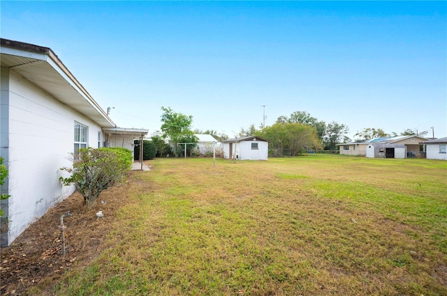 view of yard with a storage unit