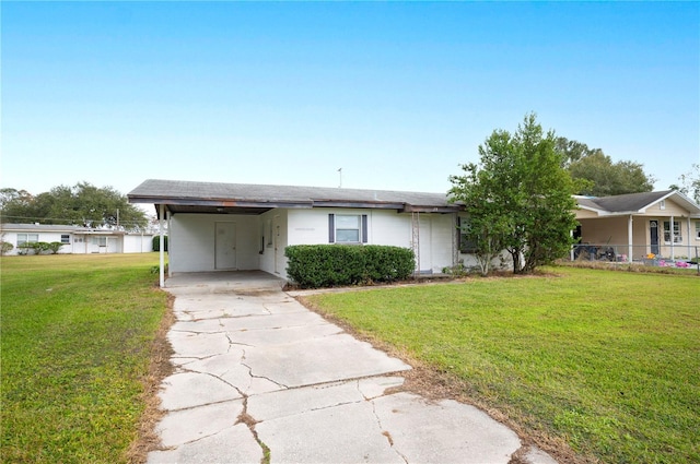 ranch-style home with a carport and a front yard