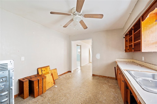 kitchen with ceiling fan and sink