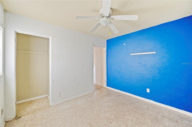 unfurnished bedroom with a closet and ceiling fan