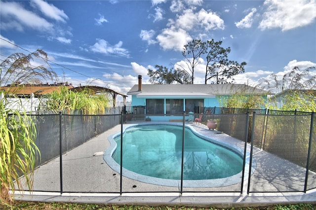 view of pool with a sunroom