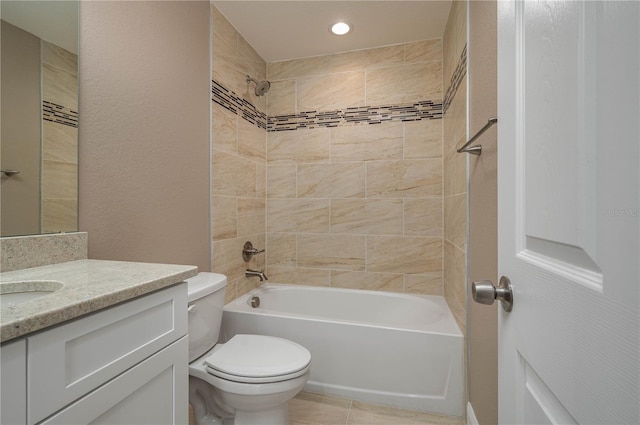 full bathroom with tiled shower / bath combo, vanity, and toilet