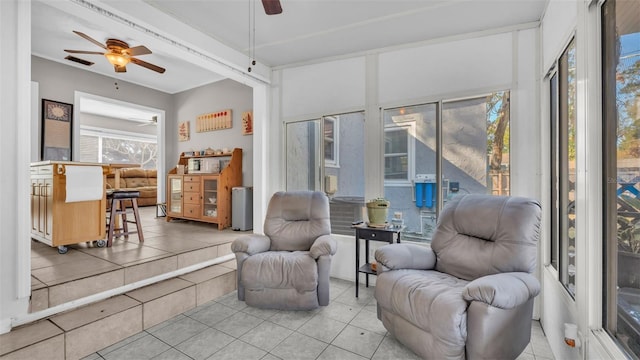 sunroom / solarium with ceiling fan