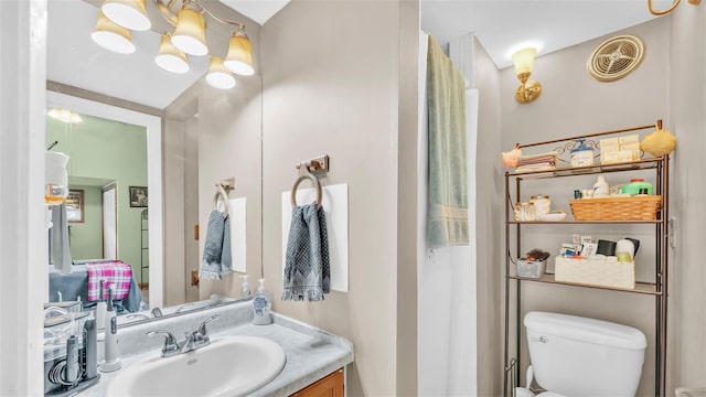 bathroom featuring vanity and toilet