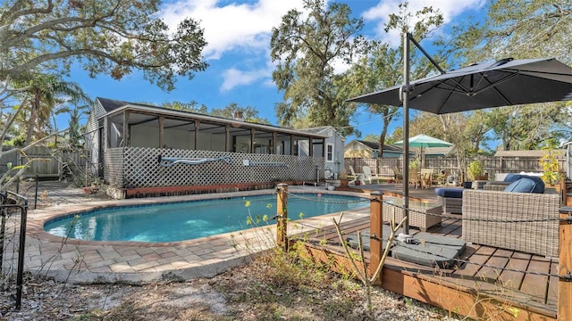 view of pool featuring a sunroom