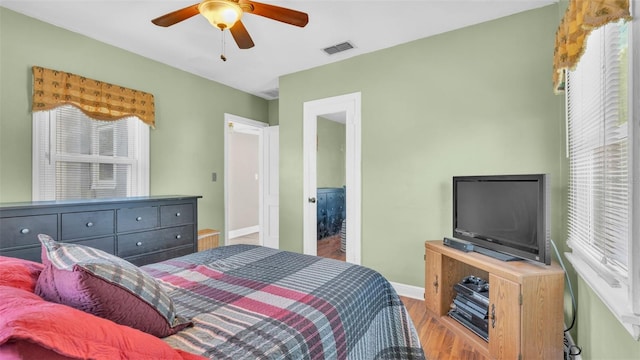 bedroom featuring hardwood / wood-style flooring and ceiling fan