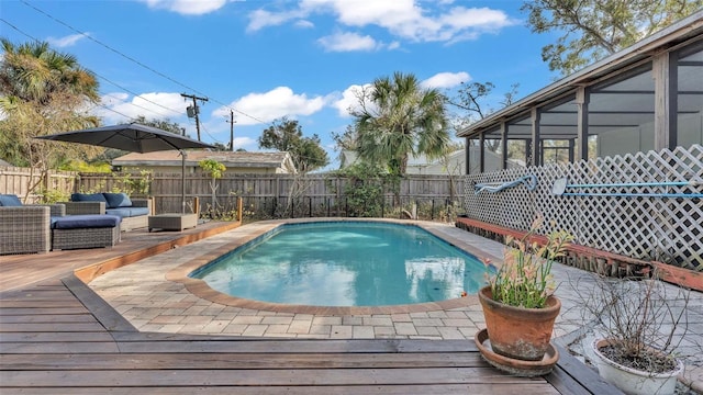 view of swimming pool featuring an outdoor living space and a deck