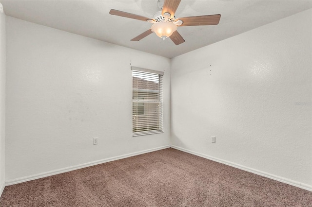 unfurnished room featuring ceiling fan and carpet floors