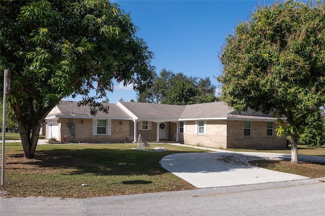 ranch-style house with a front lawn