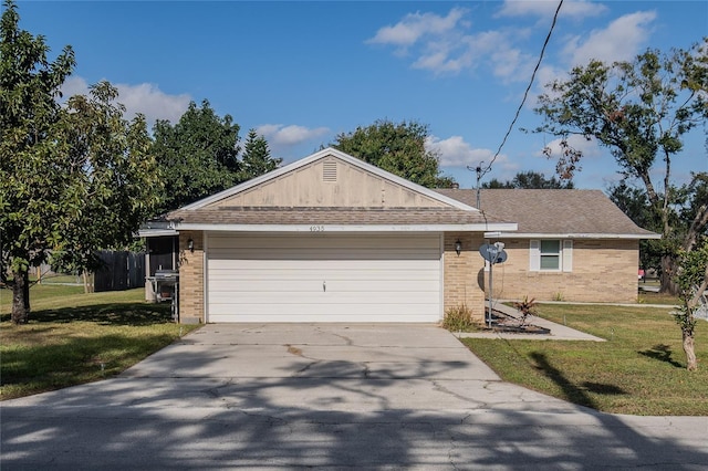 view of front of home with a garage and a front yard