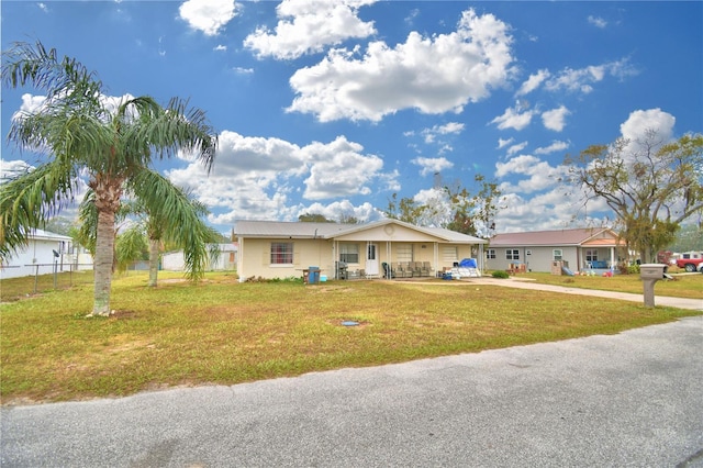 single story home featuring a front yard