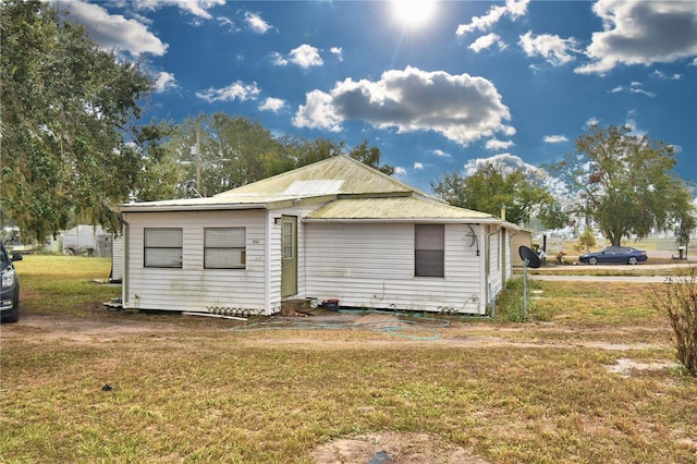 back of house with a yard