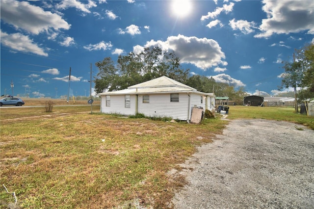 view of side of property featuring a yard