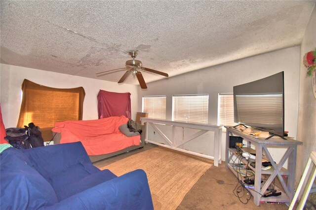 bedroom with a textured ceiling and ceiling fan