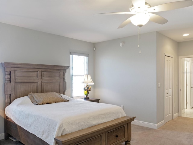 carpeted bedroom featuring ceiling fan