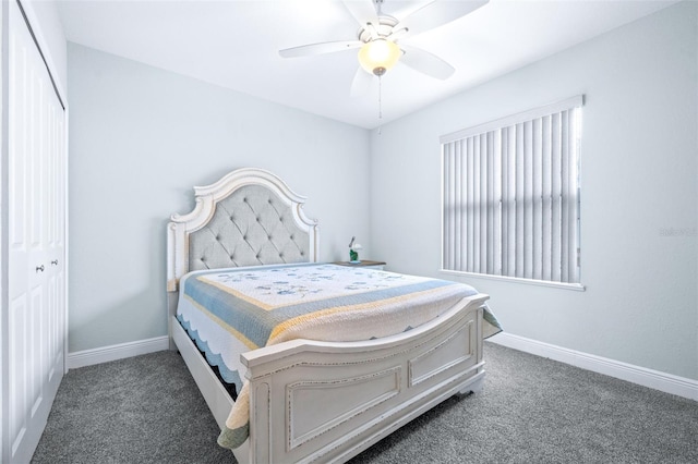 bedroom featuring baseboards, dark colored carpet, and a ceiling fan