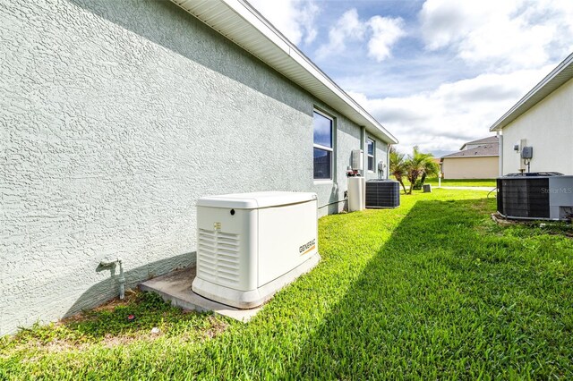 view of yard featuring central air condition unit