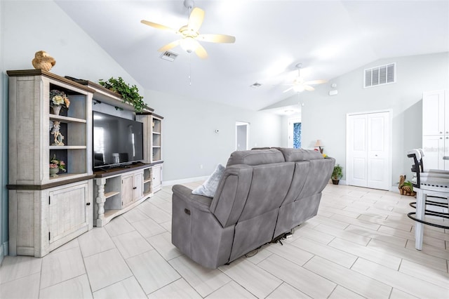 living room featuring vaulted ceiling, ceiling fan, visible vents, and baseboards