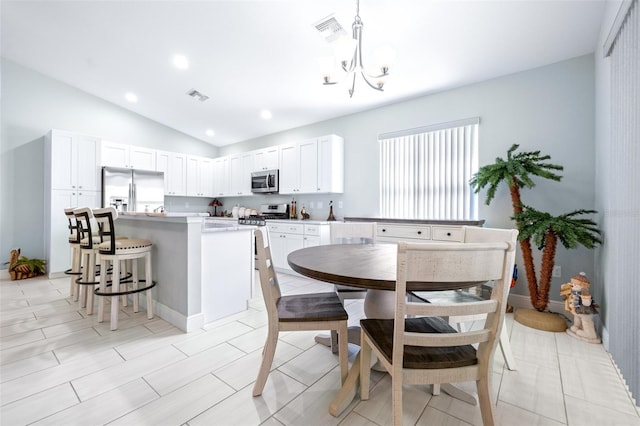 dining room with recessed lighting, visible vents, vaulted ceiling, and a notable chandelier