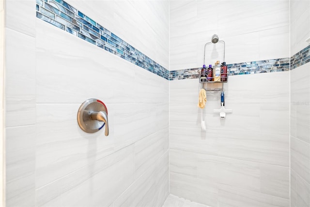 full bathroom with a tile shower