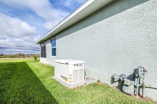 view of side of property with a lawn and stucco siding