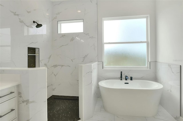 bathroom featuring a wealth of natural light, vanity, tile walls, and shower with separate bathtub