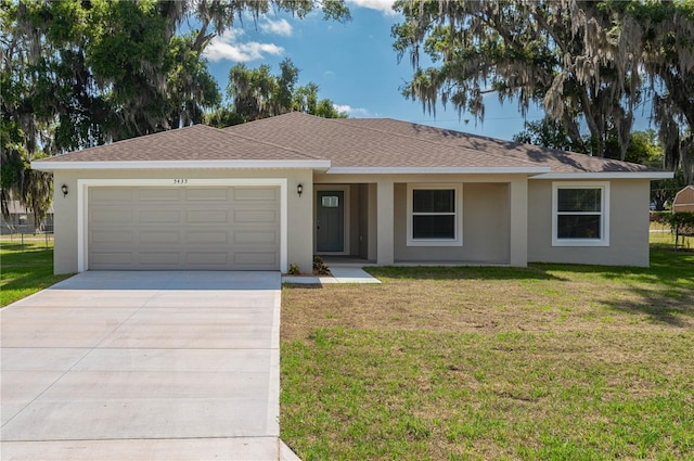 single story home with a front lawn and a garage