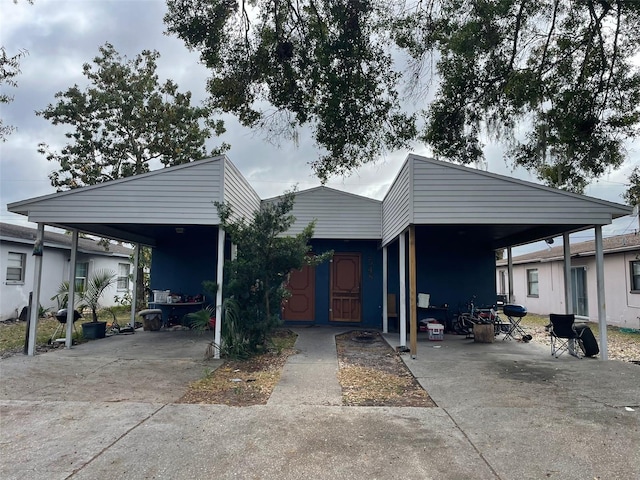 view of front of home with a carport