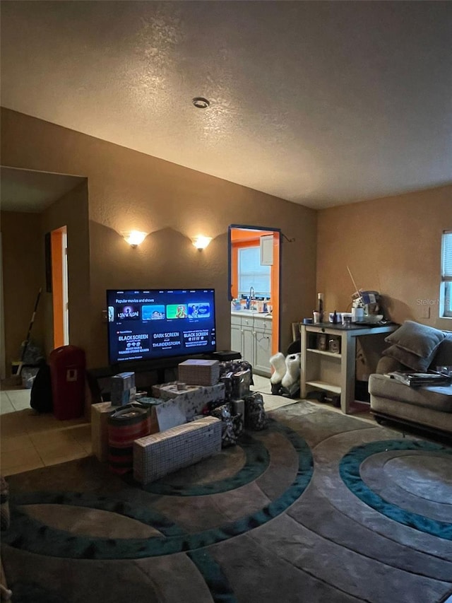 tiled living room with a textured ceiling