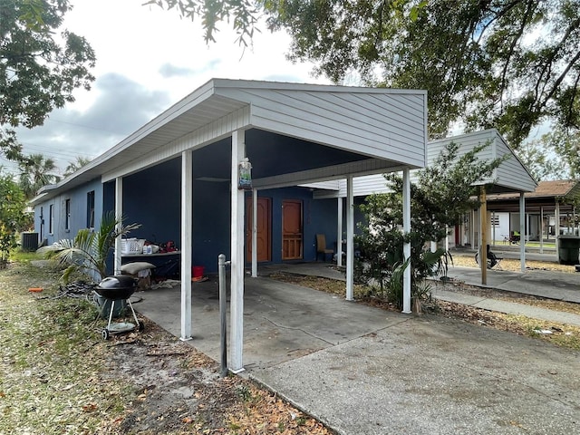 exterior space with a carport