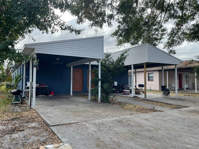 bungalow-style house featuring a carport