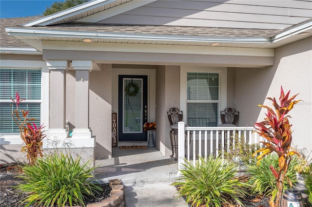 property entrance featuring covered porch