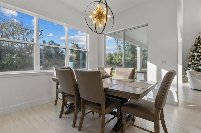 dining space with an inviting chandelier