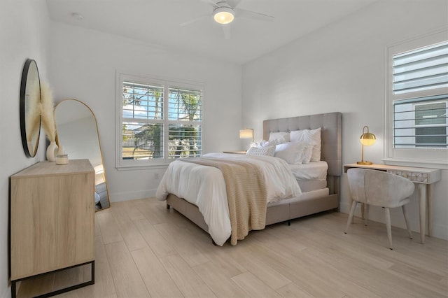 bedroom featuring ceiling fan and light hardwood / wood-style flooring