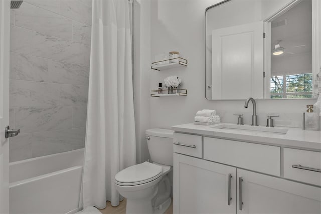 full bathroom featuring shower / bath combo, ceiling fan, toilet, and vanity