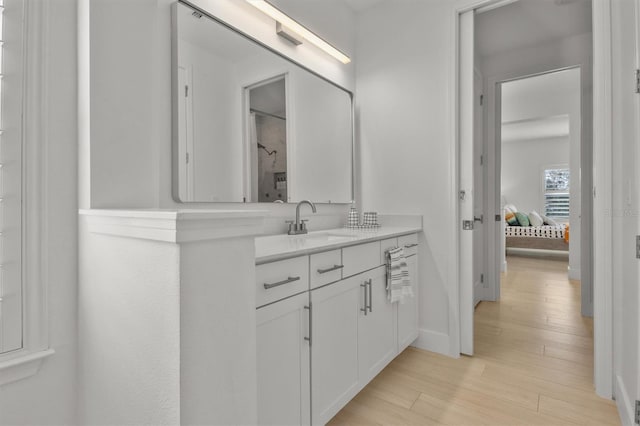 bathroom with vanity and hardwood / wood-style flooring